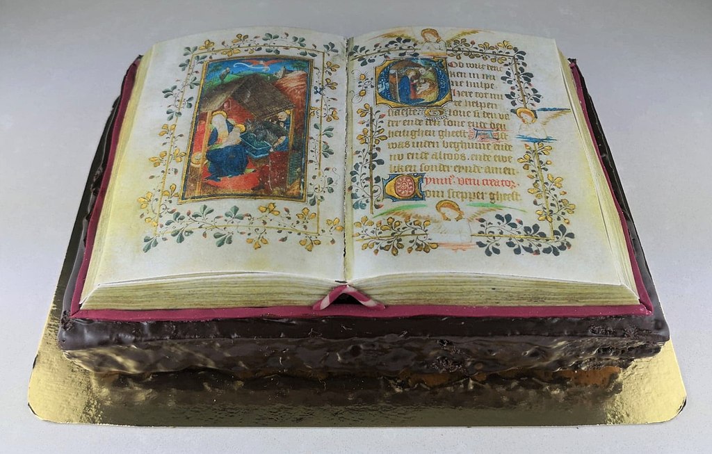 Cake in the shape of an illuminated manuscript book