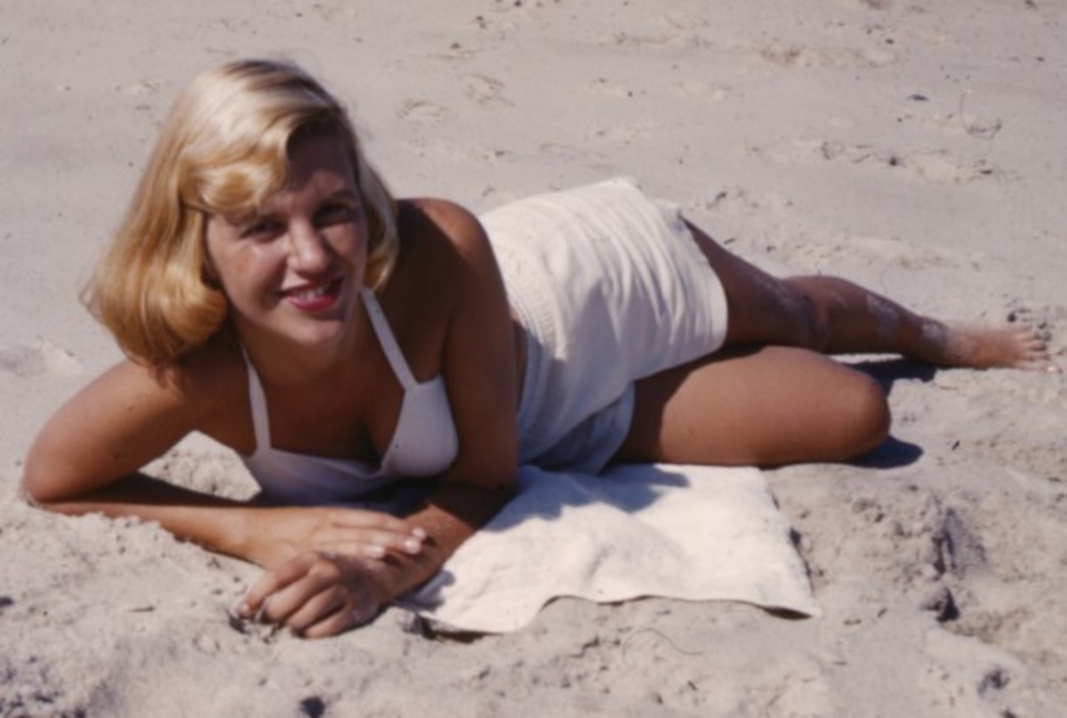 Sylvia Plath on the beach in a modest white two-piece swimsuit