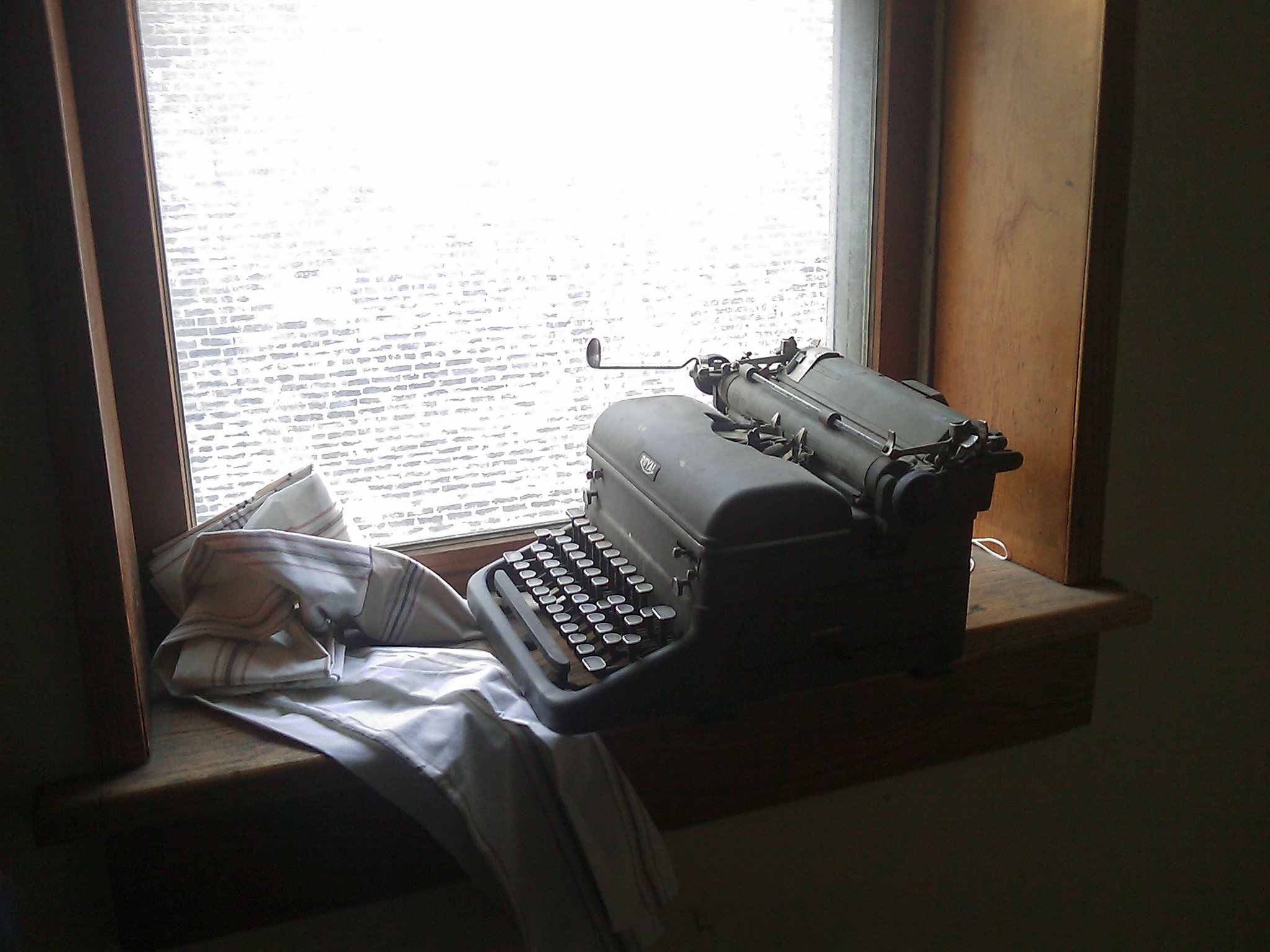Old Royal typewriter sitting on a windowsill