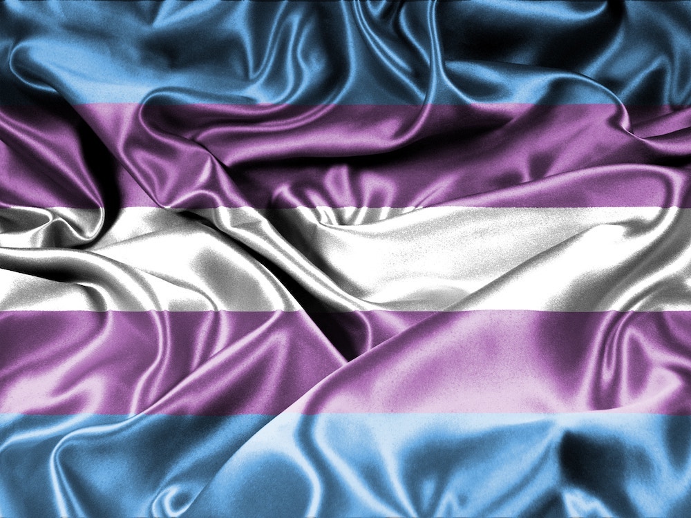Rumpled, satiny trans pride flag.