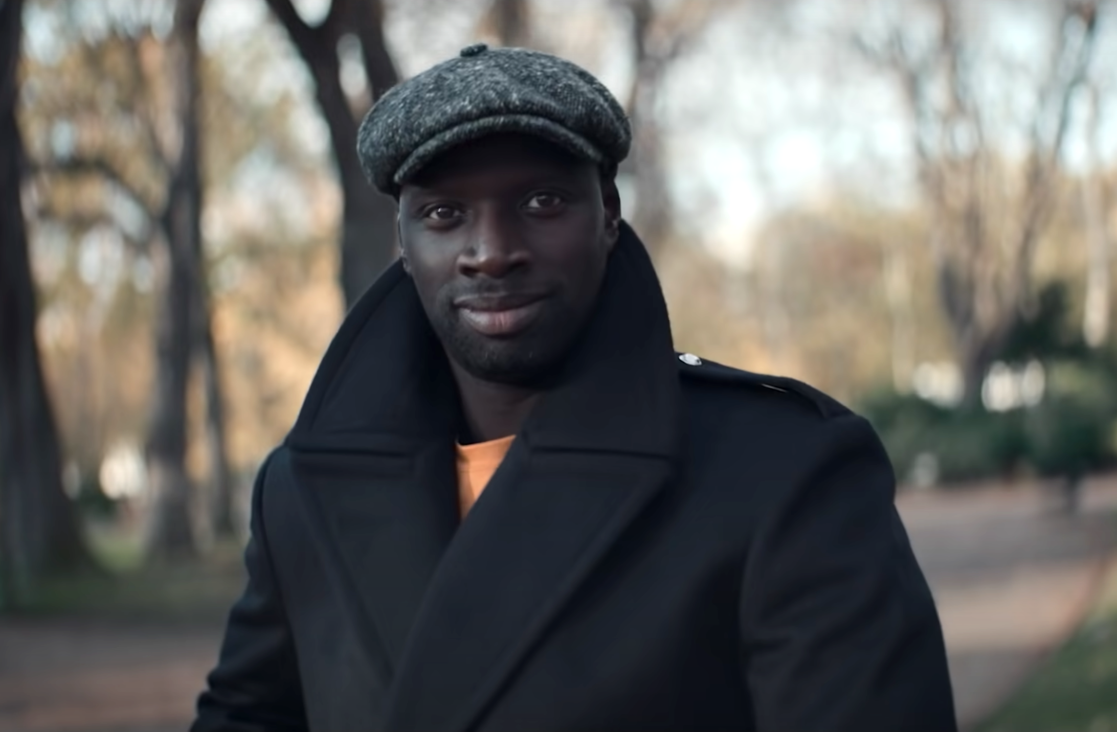 Screenshot from Lupin of Omar Sy wearing winter clothing